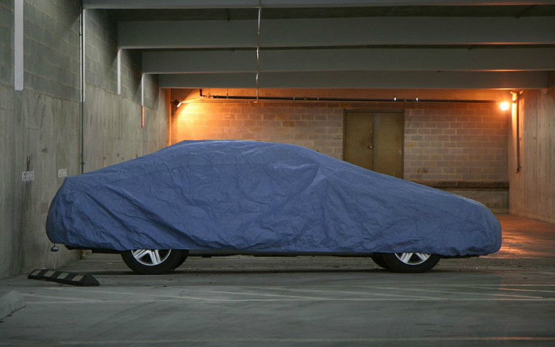 car in storage with fitted cover